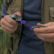 Load image into Gallery viewer, Super SNIP Fishing Line Cutter with Glow Jig Charging U/V Light, Cuts 50 lb. Braided Fishing Line, Mono, and Fluoro Lines Clean and Smooth!
